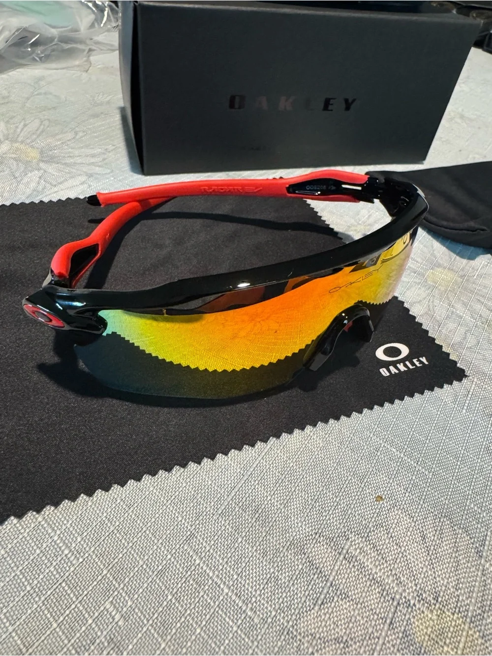 Oakley sports sunglasses — Black frame with Red temples and Yellow mirrored lens